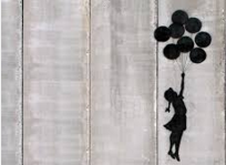 stencil by Banksy on apartheid wall